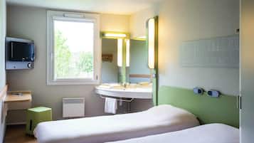 Chambre avec lits jumeaux, 2 lits une place | Bureau, chambres insonorisées, Wi-Fi gratuit, draps fournis