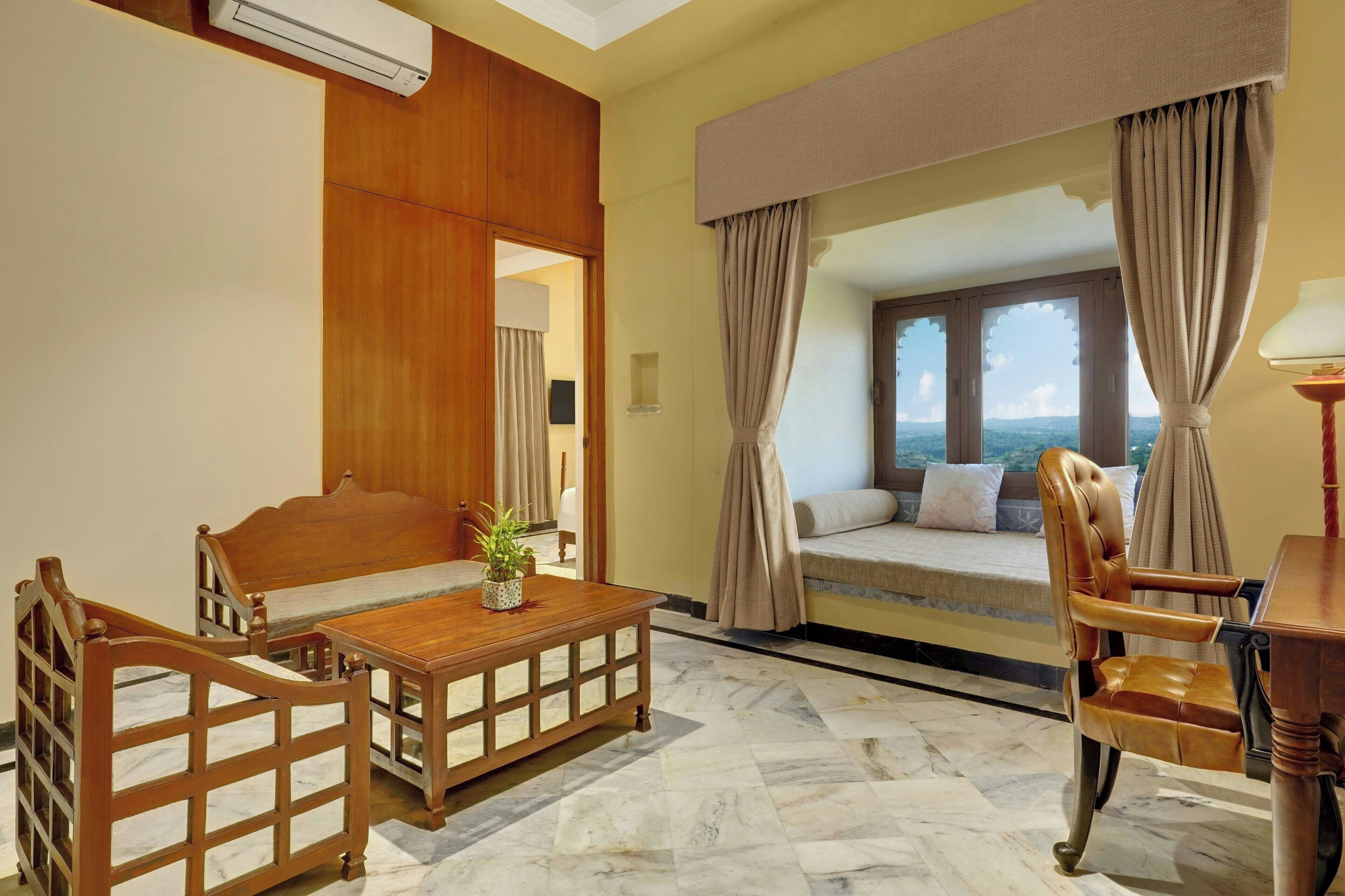 Classic Room, 1 King Bed, Mountain View | Living room | 42-inch LED TV with cable channels