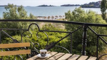 Deluxe Apartment, 1 Bedroom, Sea View | In-room safe, desk, blackout curtains, iron/ironing board