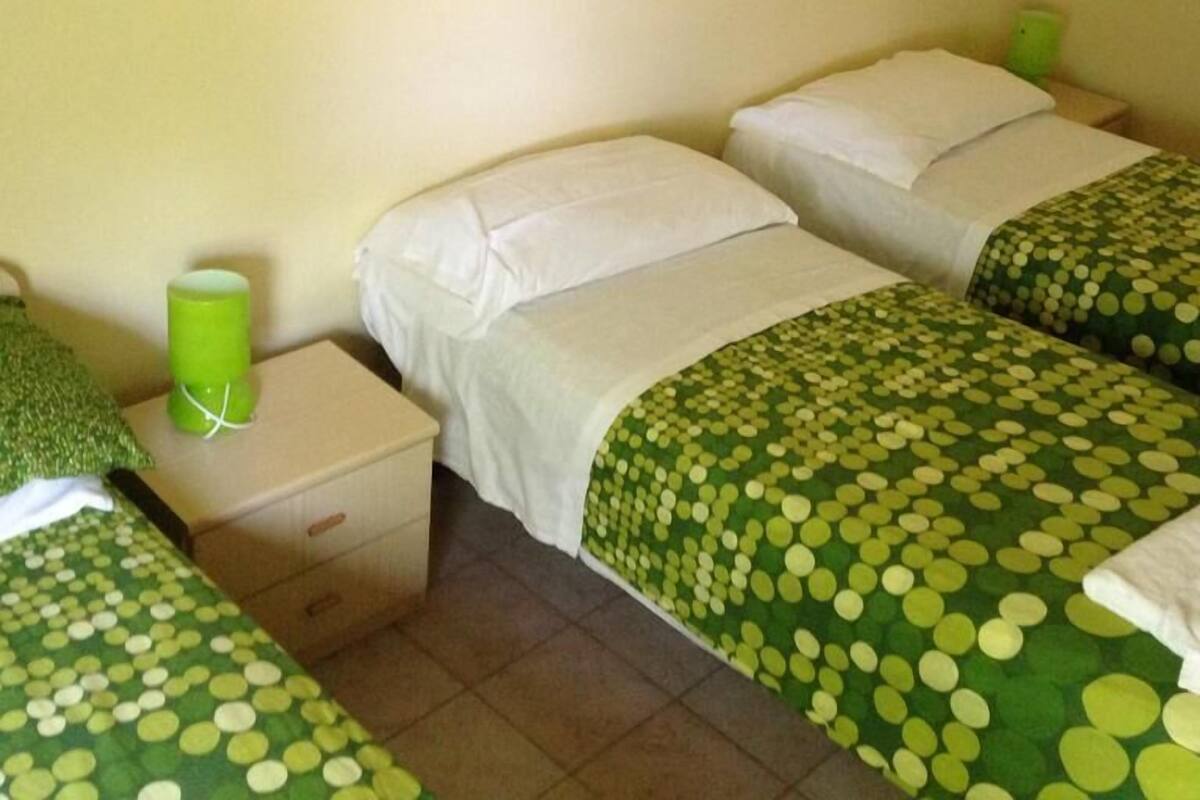 Triple Room, Garden View | Desk, blackout curtains, cots/infant beds, free wired Internet