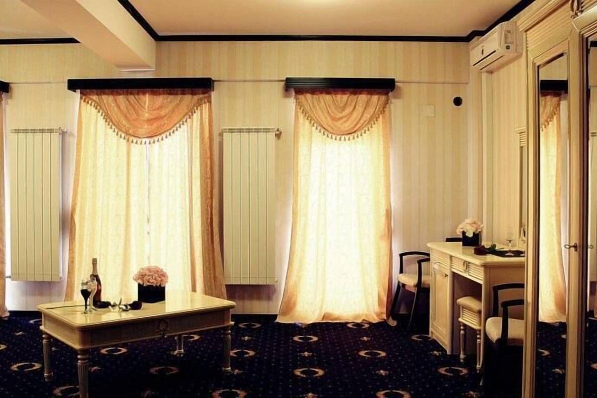 Deluxe Suite, 1 King Bed | Living area | LCD TV