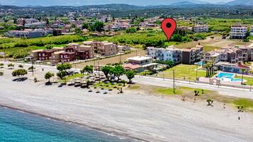 Enjoy a seaside escape with access to a sandy beach and scenic views of the surrounding hills.