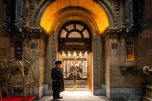 A grand entrance with a sign reading "HOTEL" and "SPA".