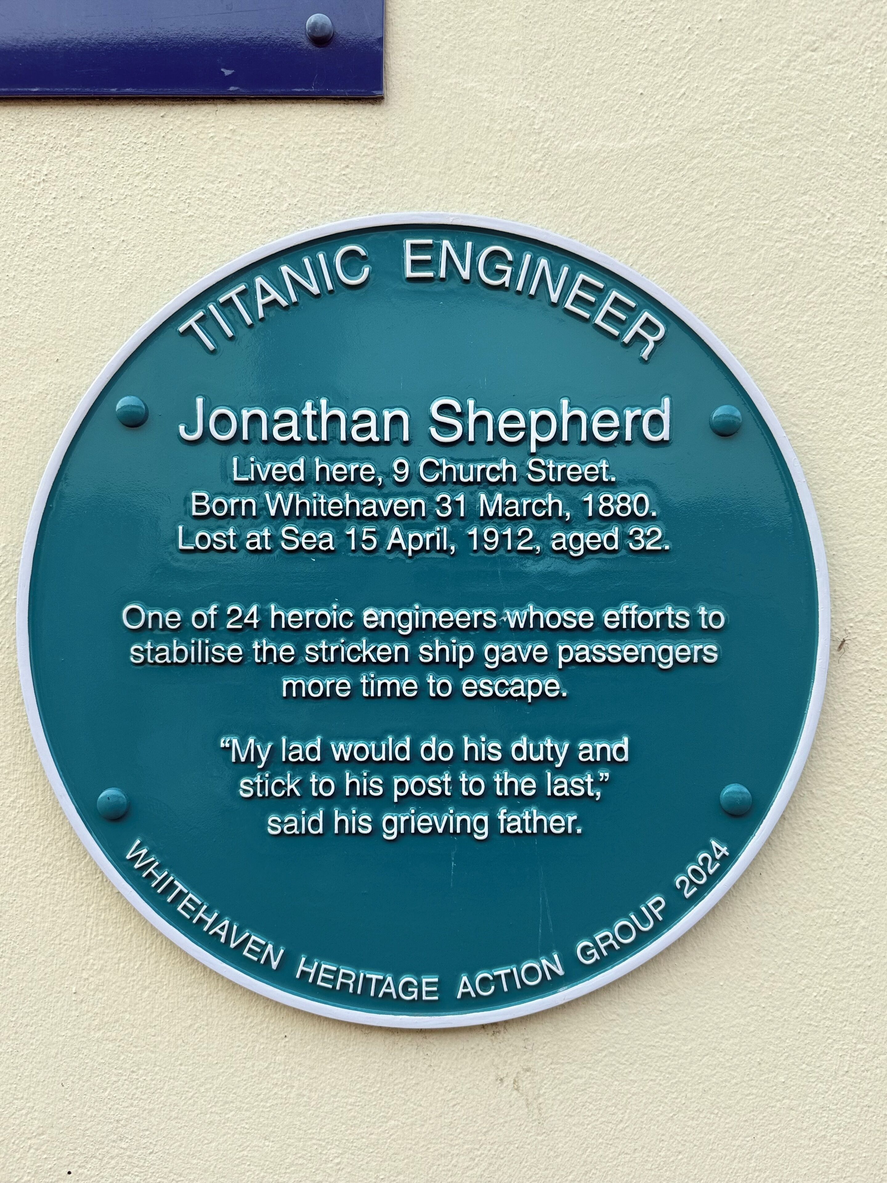 A commemorative plaque on a wall.