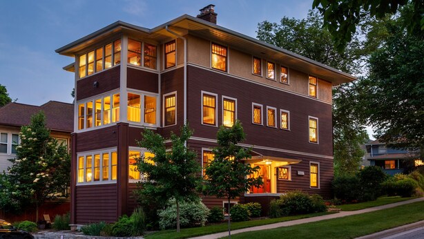 A two-story house with multiple windows and a well-maintained lawn. - The Buckingham Inn (Madison)