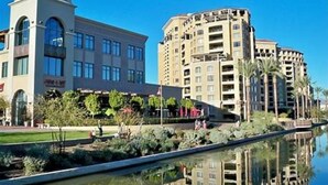 A hotel with a modern architectural style, featuring a central tower and multiple balconies. - Great Location, Quiet, Beautiful and Comfortable Scottsdale Retreat (Scottsdale)