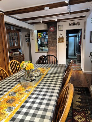 Dining room overlooking the kitchen and back porch.  - Snuggle up in the woods, 7 miles to Lake George,NY (Lake Luzerne)