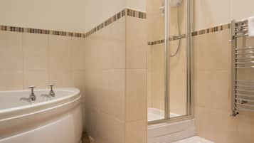 Bathtub, hair dryer, towels, soap