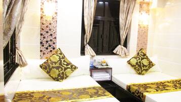 Family Room, 2 Double Beds | In-room safe, desk, free WiFi, bed sheets