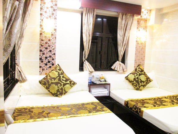 Family Room, 2 Double Beds | In-room safe, desk, free WiFi, bed sheets