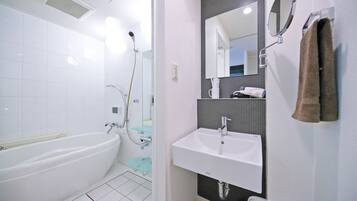 Separate tub and shower, free toiletries, hair dryer, slippers