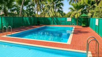 Outdoor pool, open 7:00 AM to 10:00 PM, pool umbrellas, pool loungers