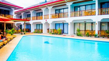 Outdoor pool, open 7 AM to 10 PM, pool umbrellas, sun loungers