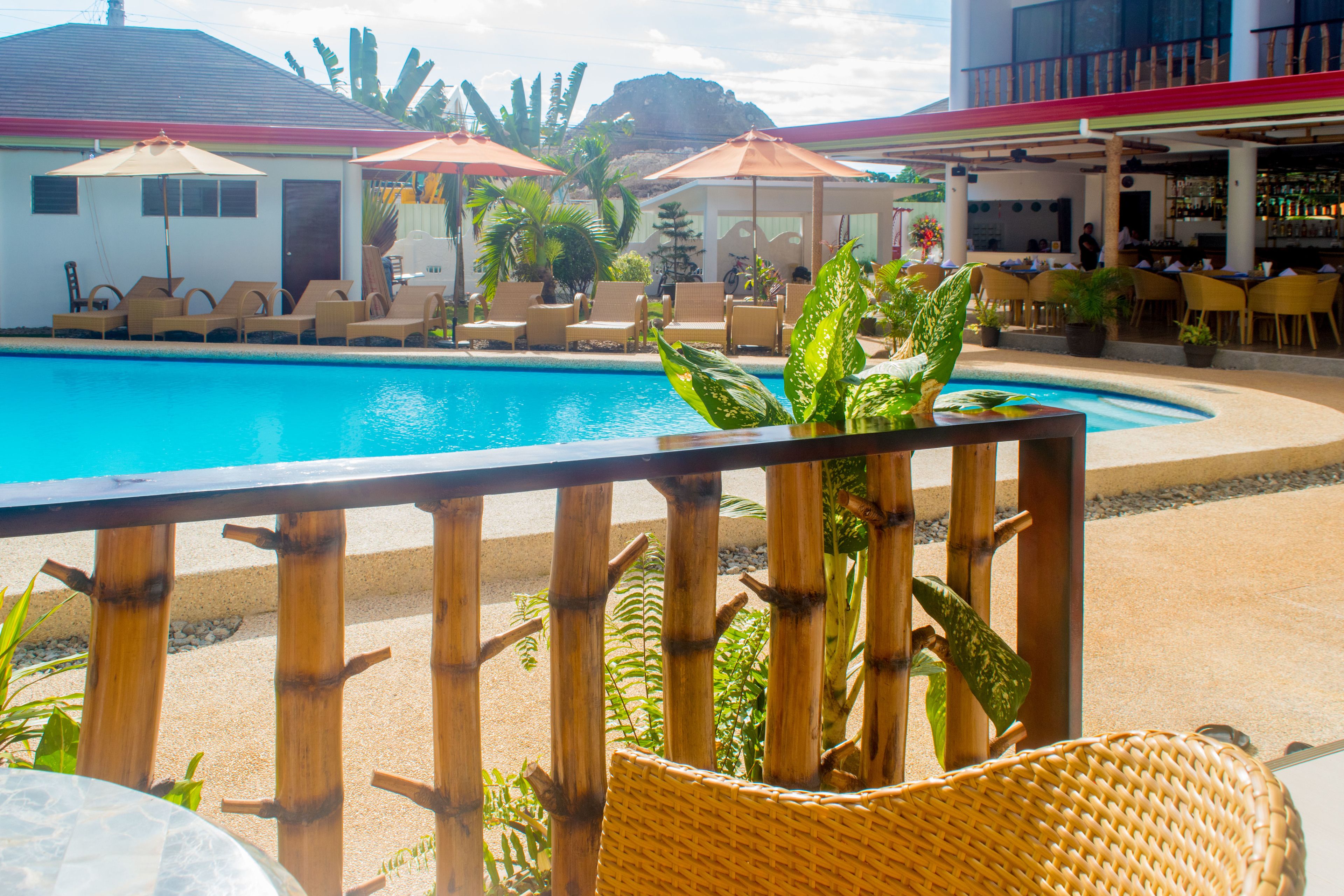 outdoor pool, open 7 am to 10 pm, pool umbrellas, pool loungers