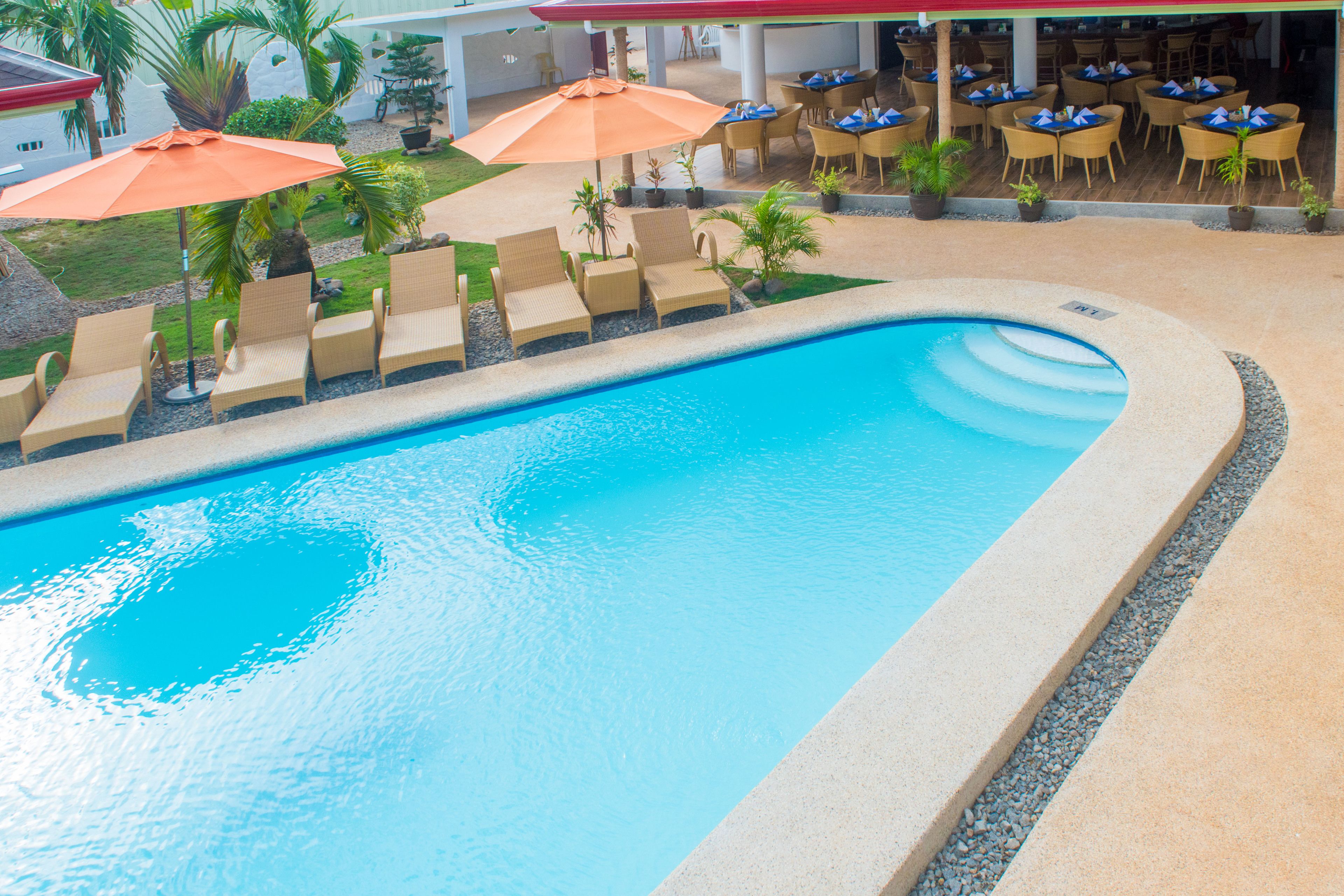 outdoor pool, open 7 am to 10 pm, pool umbrellas, pool loungers