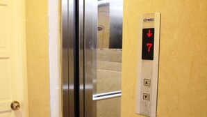 An elevator with a digital display showing the floor number 7, and two buttons labeled 'A' and 'Y'. - Zen Hotel (Nha Trang)