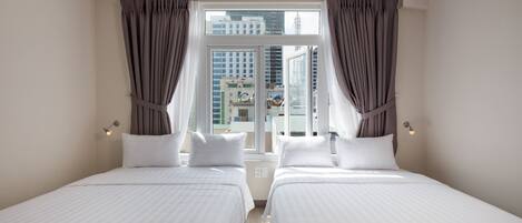 Deluxe Quadruple Room, 2 Double Beds, Partial Ocean View | Hypo-allergenic bedding, minibar, free WiFi, wheelchair access