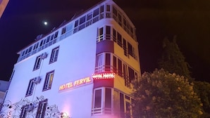 A multi-story building with balconies and a lit sign reading "HOTEL FERYIL". - Hotel Feryıl Liman (Fethiye)