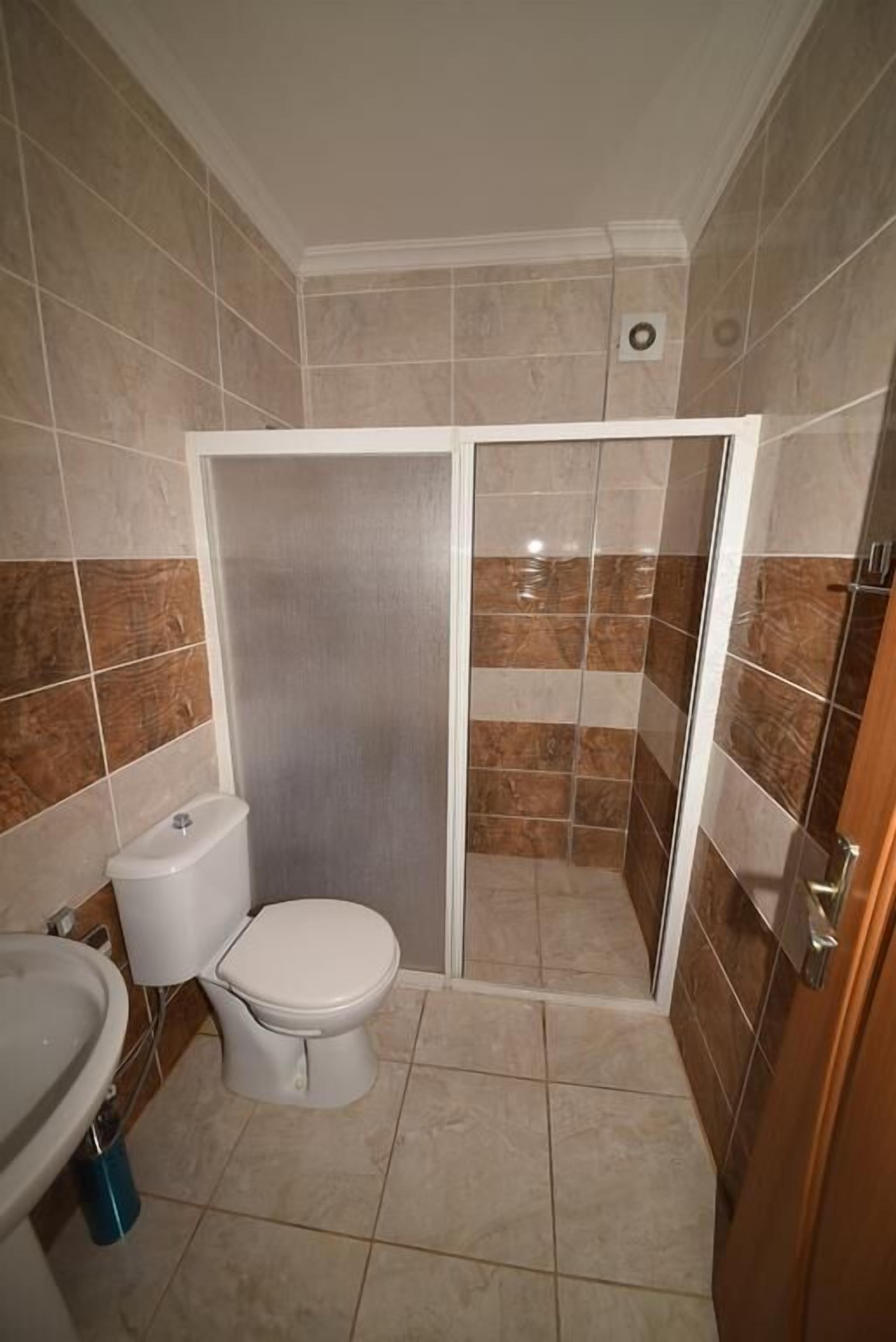 Shower, hair dryer, slippers, towels