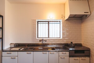 Full-size fridge, microwave, stovetop, coffee/tea maker