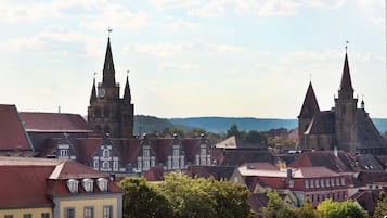 A historic town with prominent church spires and traditional architecture.