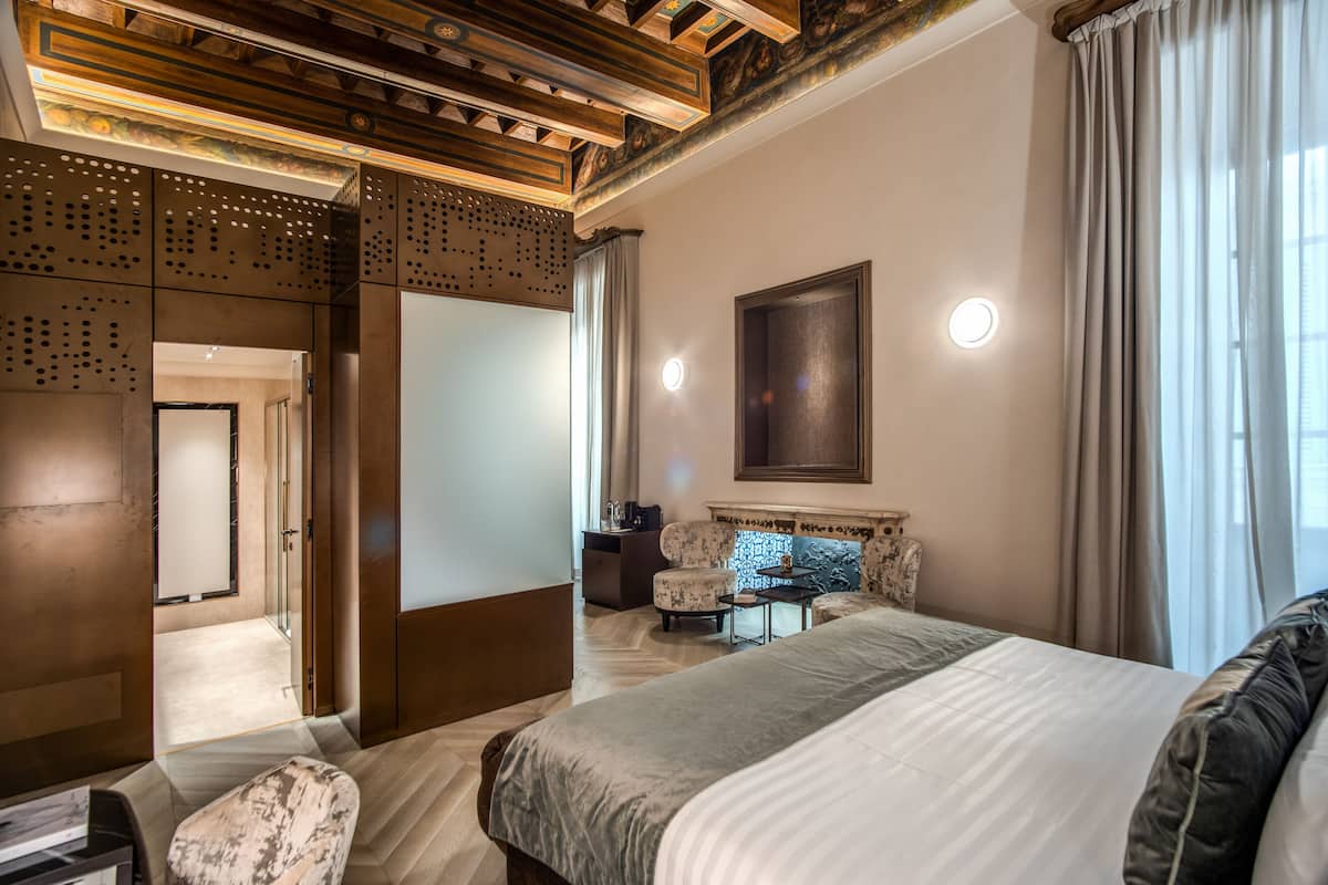 Junior Suite | 1 bedroom, premium bedding, down comforters, minibar
