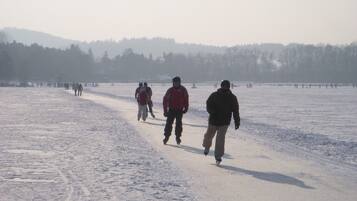 A snowy landscape with people walking.