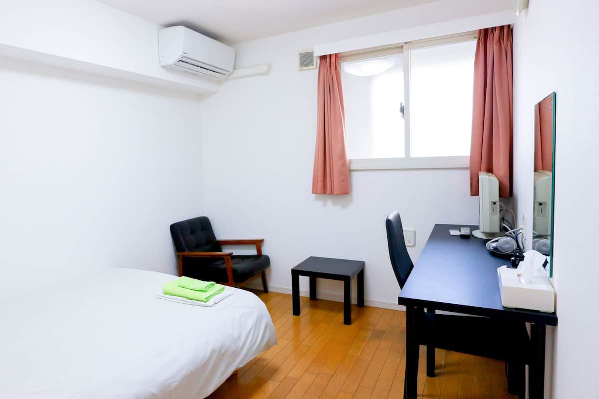 Desk, laptop workspace, blackout curtains, free WiFi