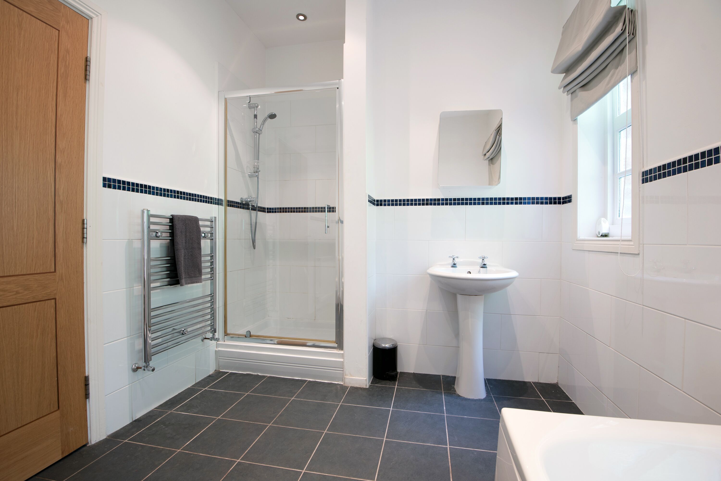 Bathtub, hair dryer, towels, soap