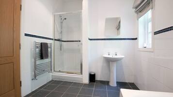 Bathtub, hair dryer, towels, soap