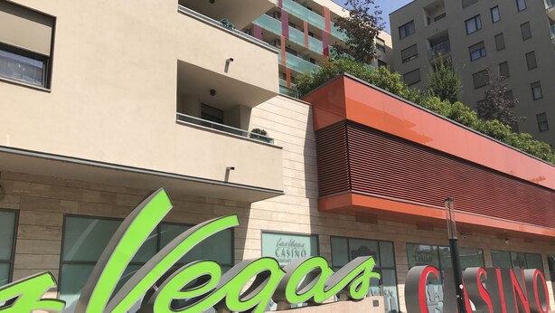 A building with large green and red signage reading "Vegas Casino." - Corvin Rose Apartment Hotel (Budapest)