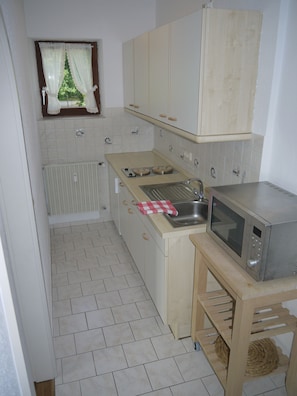 Fridge, microwave, stovetop, coffee/tea maker