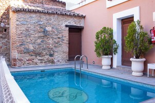 Outdoor pool, open 11:00 AM to 10:00 PM, pool umbrellas, sun loungers