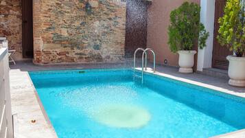 Outdoor pool, open 11:00 AM to 10:00 PM, pool umbrellas, pool loungers