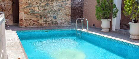 Outdoor pool, open 11:00 AM to 10:00 PM, pool umbrellas, sun loungers
