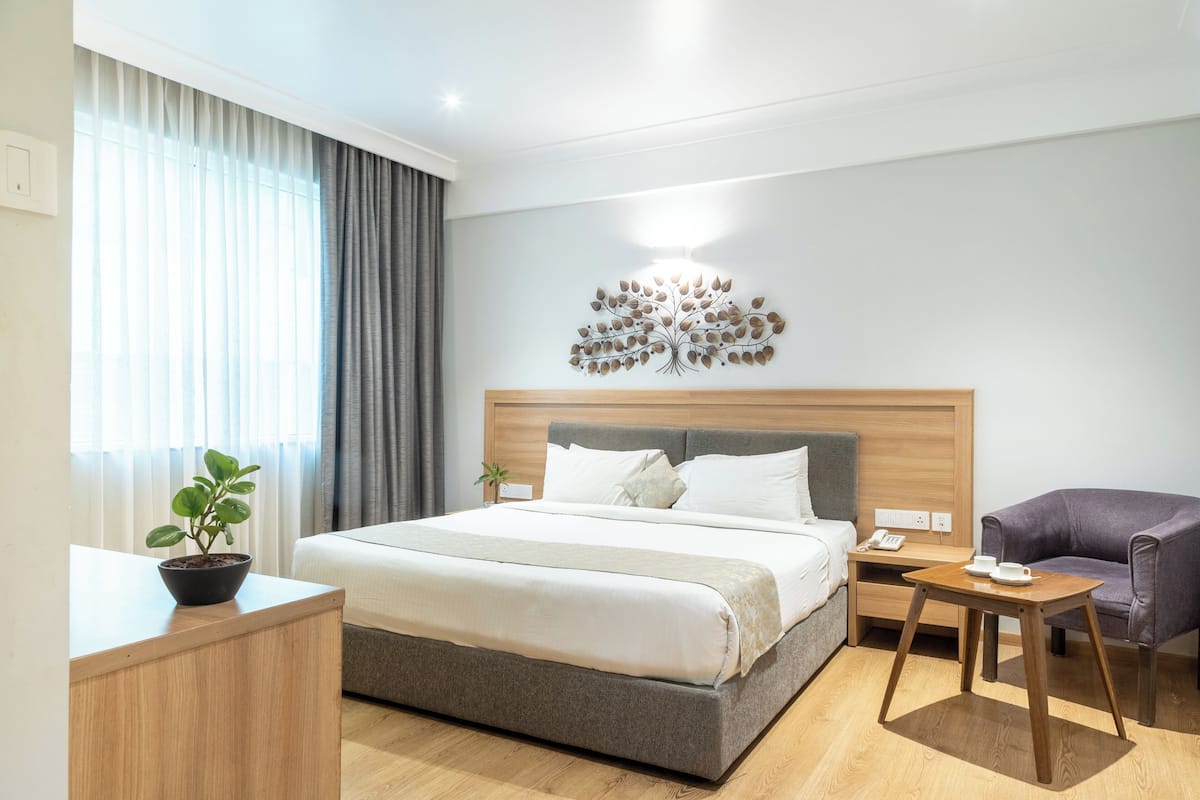 Habitación superior | Ropa de cama de alta calidad y minibar