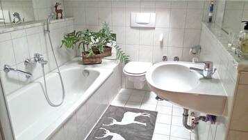 Bathtub, hair dryer, towels