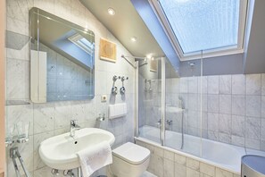 Bathtub, hair dryer, towels