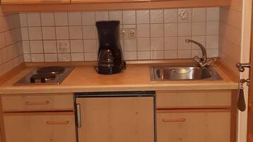 Fridge, microwave, stovetop, coffee/tea maker