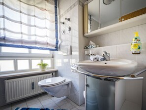 Bathtub, hair dryer, towels