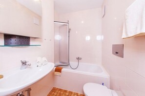 Bathtub, hair dryer, towels