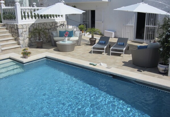 Seasonal outdoor pool, pool umbrellas, pool loungers