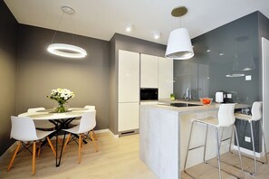 Deluxe Apartment, 1 Bedroom (B105) | Private kitchen | Full-size fridge, stovetop, dishwasher, espresso maker