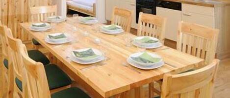 Enjoy meals in this dining area with a long table and six comfortable chairs.