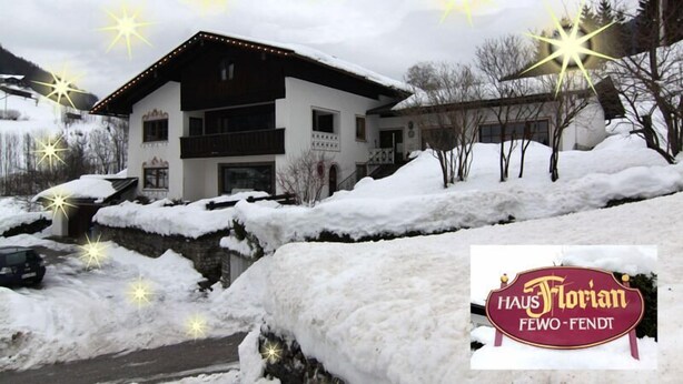 A snow-covered building with a sign reading "Haus Florian FEWO-FENDT". - Ferienwohnung Nr.2 für 2-4 Personen (Berchtesgaden)