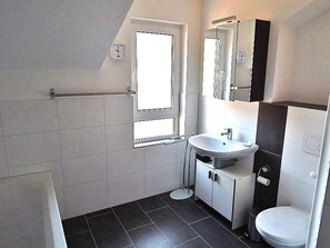 Bathtub, hair dryer, towels