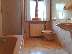Bathtub, hair dryer, towels