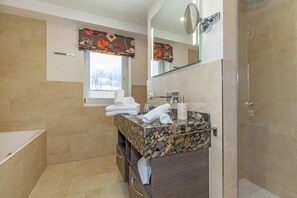 Bathtub, hair dryer, towels
