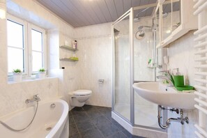 Bathtub, hair dryer, towels
