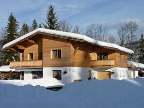 Enjoy the serene views from the upper floor balcony of this chalet-style building.